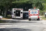 View of two ambulances and police cruiser